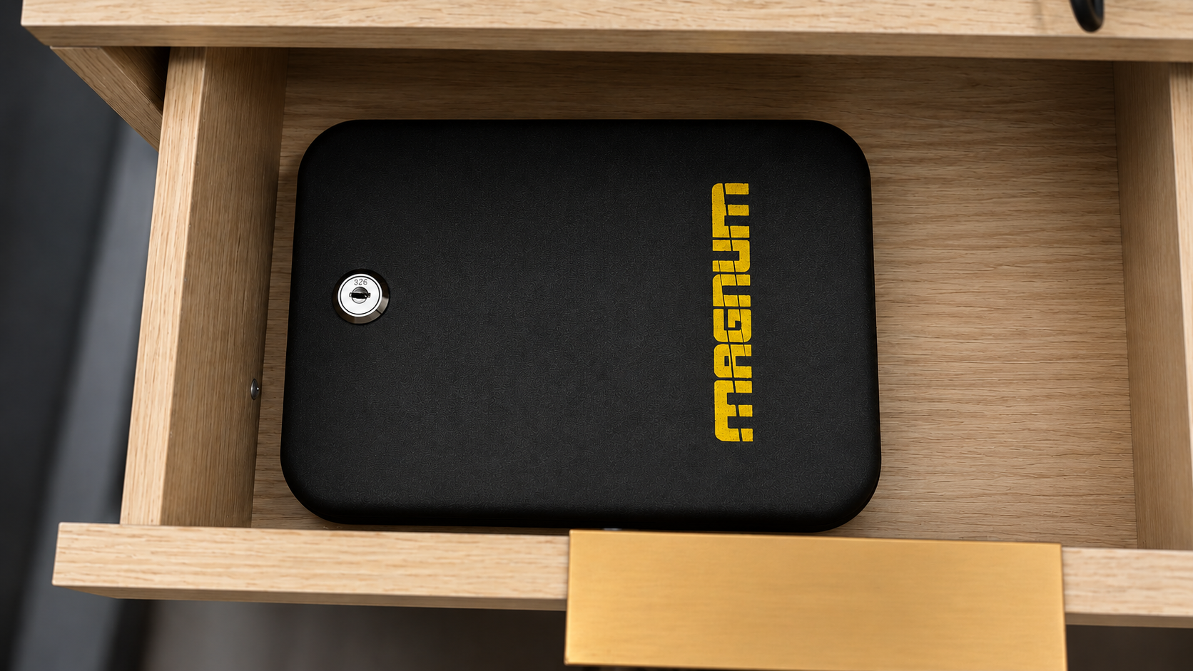 Magnum Key-Lock Security Case on a Nightstand Drawer